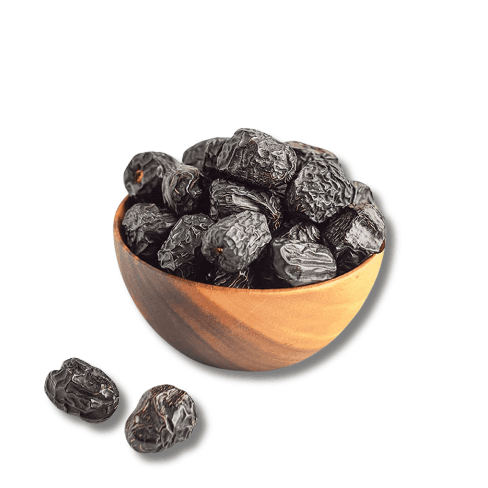 Premium Ajwa dadels uit Medina In een houten kom